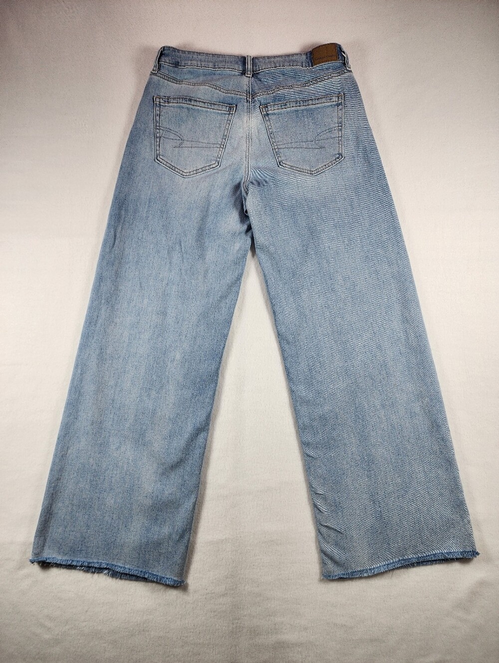 American Eagle Baggy Wide Leg Jeans Low Rise Raw Hem Light Wash Size 4 - Picture 12 of 12